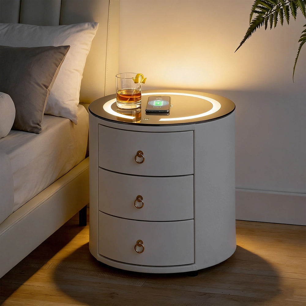 Brookline bedside table at night with LED light on and phone charging wirelessly.