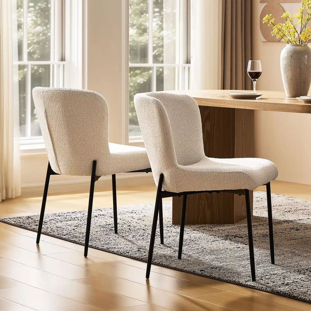 Two cream Celeste Dining Chair beside a dining table, adding a soft touch to the dining room.