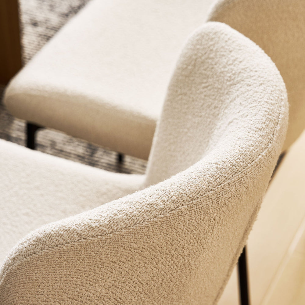 Close-up of the boucle fabric detail on the backrest of the cream Celeste Dining Chair.