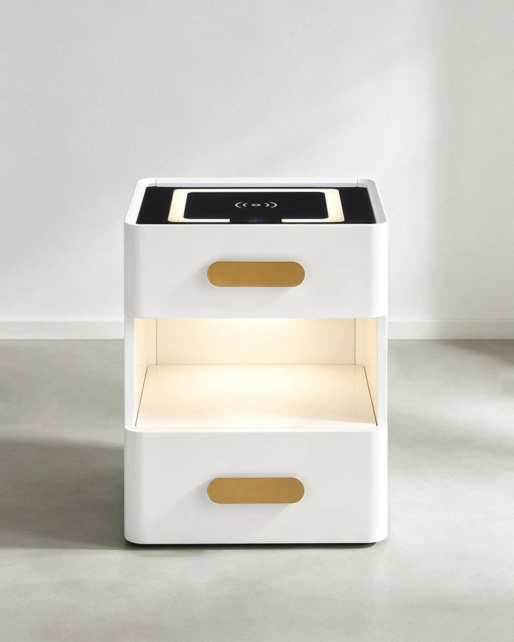 Front studio shot of the Clara white nightstand with the middle LED light turned on against a plain background.