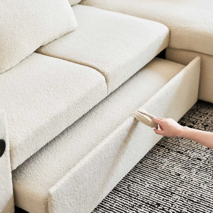 Woman pulling out underframe of Clarkson 3-Seater Boucle Sofa Bed, functional and easy sofa-to-bed design