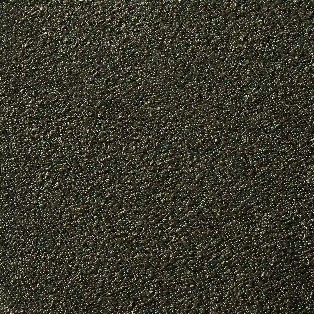 Macro texture swatch of the premium olive green bouclé fabric, showing the tactile looped yarns, rich colour depth, and durable weave.