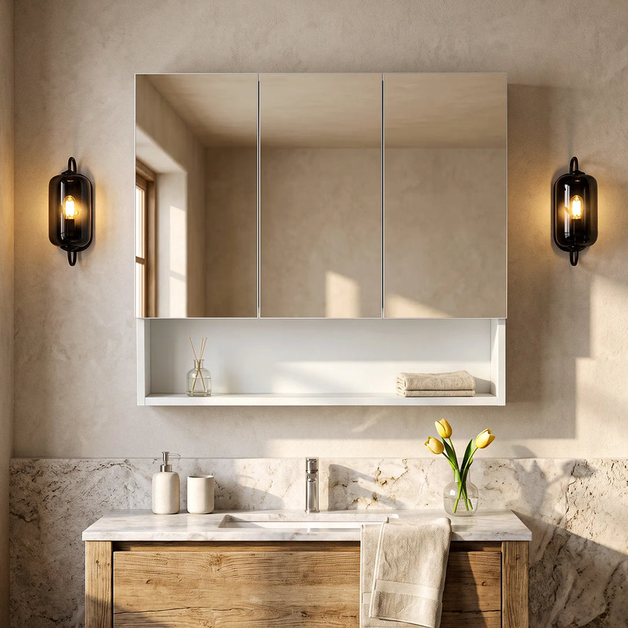 Colin Bathroom Mirror Cabinet in a bright bathroom with 3 mirror panels and an open shelf