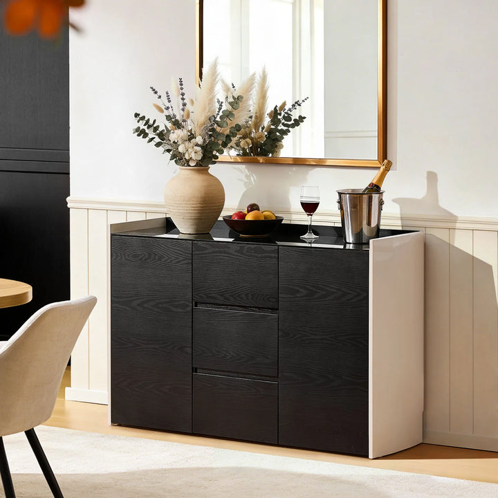 The Dakota Large Dining Sideboard is in the dining room, with red wine placed on the tabletop.