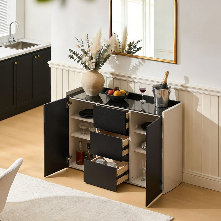 The Dakota Large Dining Sideboard, when placed in the dining room, reveals all of its storage space when the drawers and cabinet doors are opened.