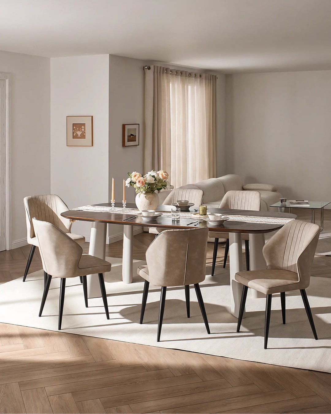 Full dining set view showing multiple Danforth beige chairs around a large rectangular table.