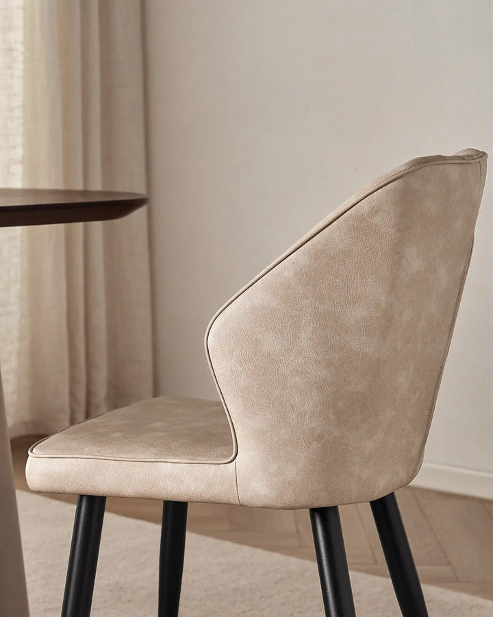 Close-up of the sleek winged side profile of the Danforth upholstered chair.