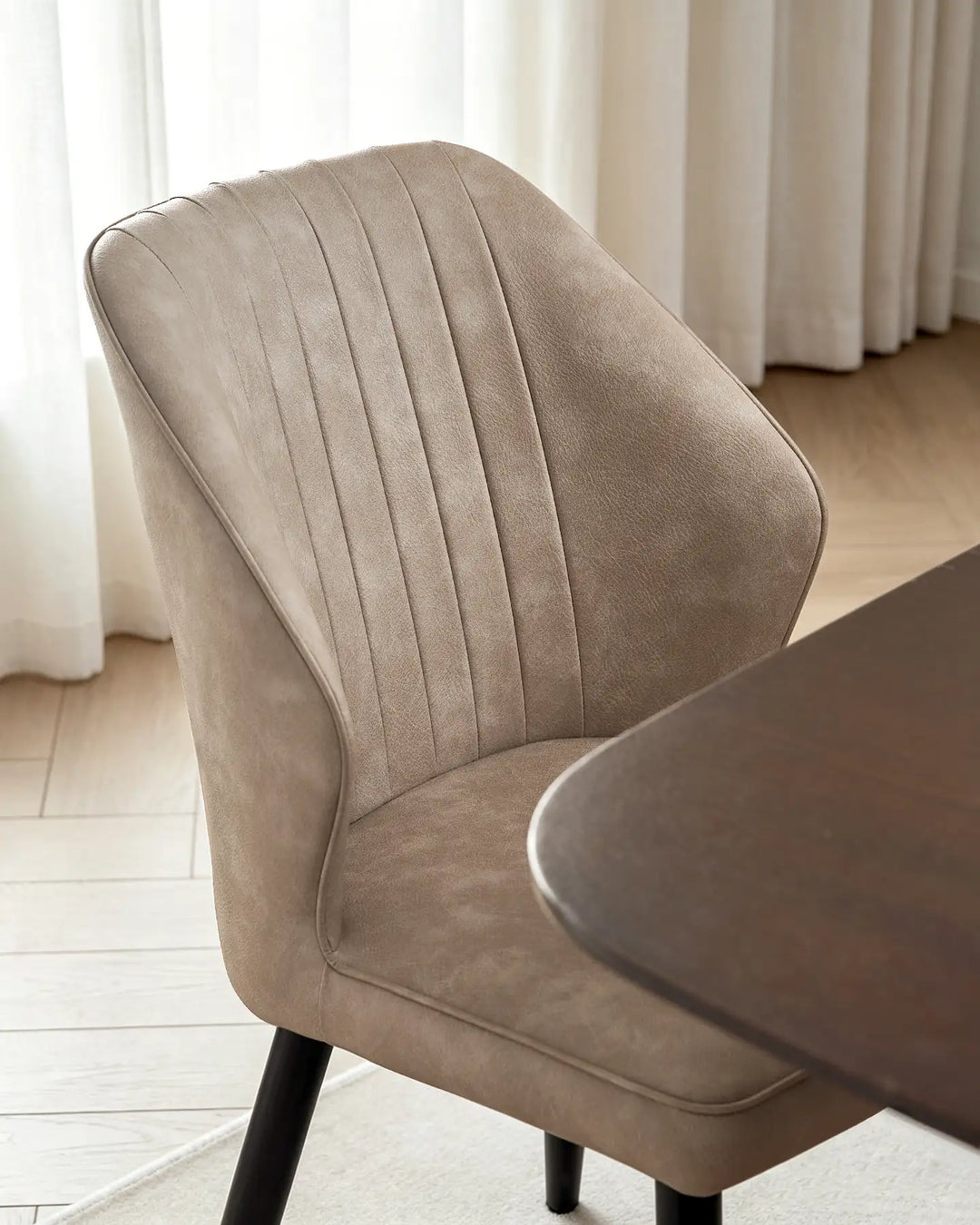 Top-down view showing the ergonomic curved back design of the Danforth dining chair.