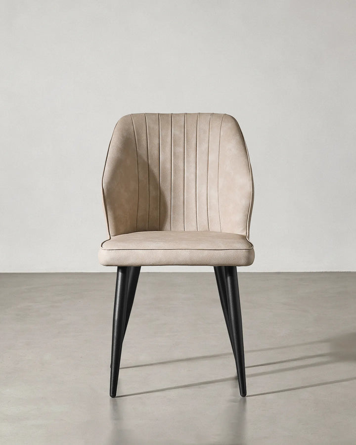 Front view of the Danforth faux leather chair highlighting its symmetrical contemporary design.
