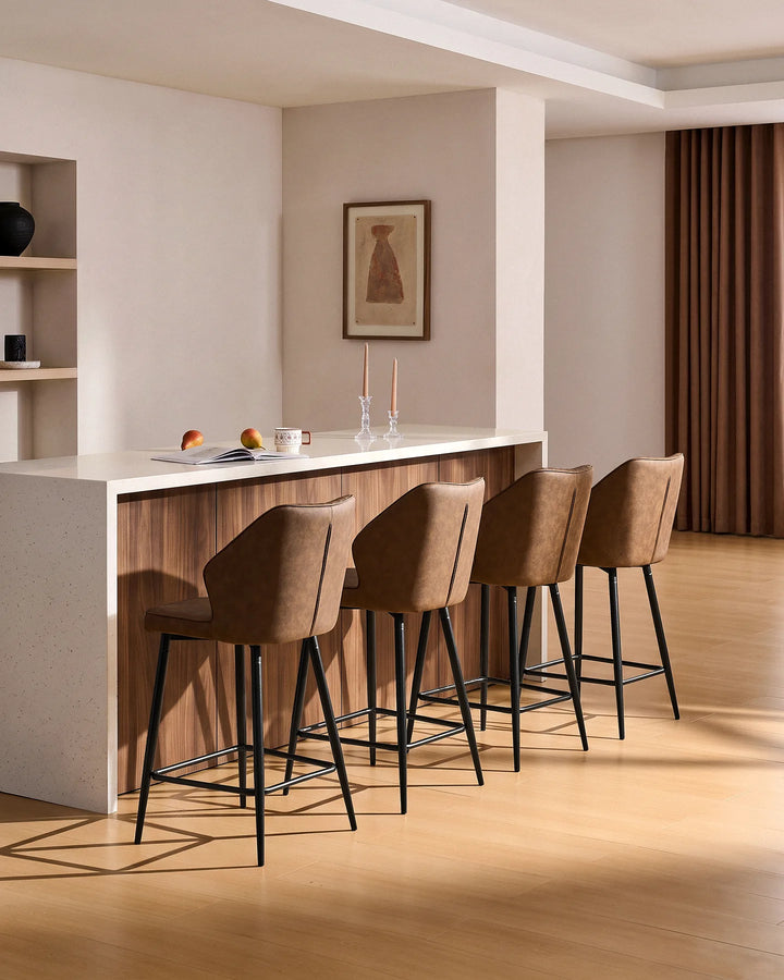 Danforth Brown bar stools styled around a wood and white kitchen island in a warm modern interior with natural wood flooring