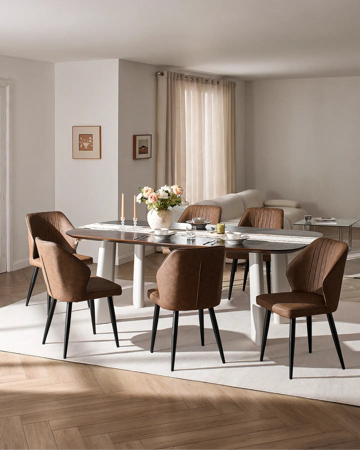 Full dining set view showing multiple Danforth beige chairs around a large rectangular table.