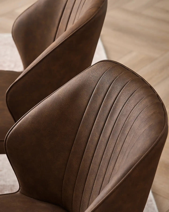 Close-up of the vertical fluted stitching on the Danforth brown faux leather backrest.