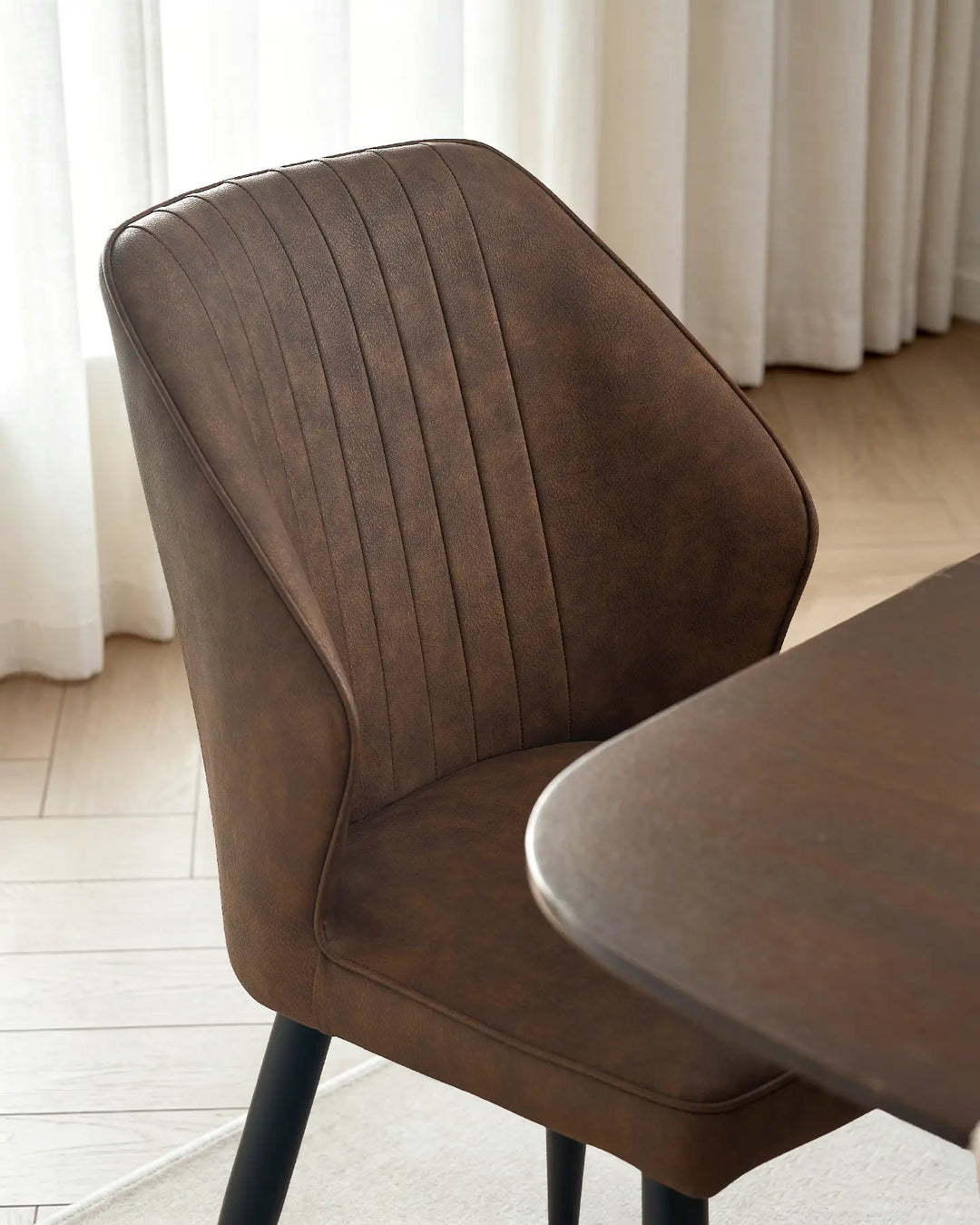 Top-down view showing the ergonomic curved back design of the Danforth dining chair.