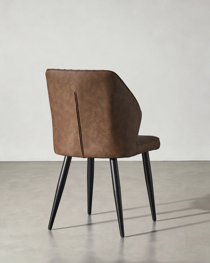 Rear view of the Danforth dining chair showcasing the clean finish of the upholstery.