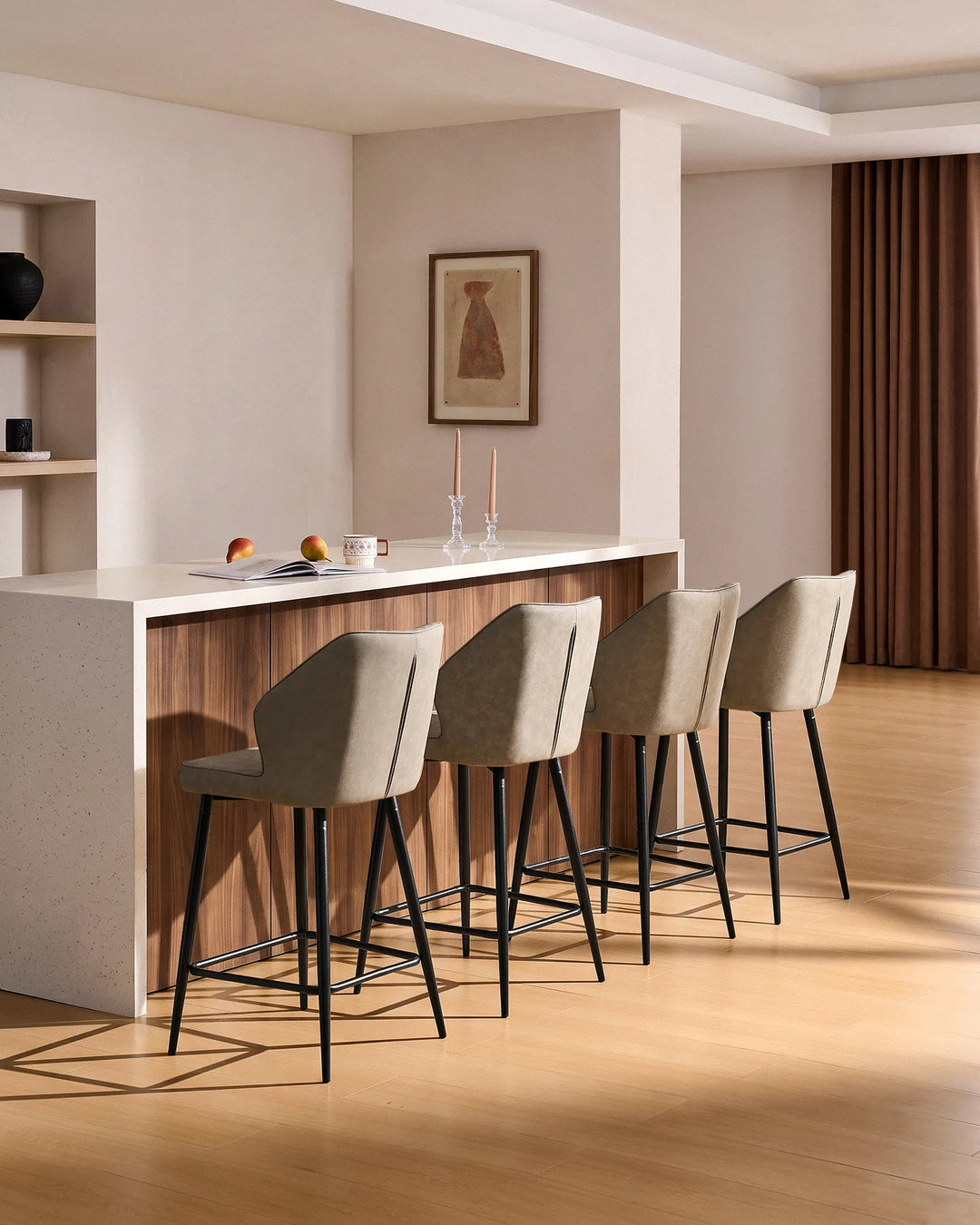 Danforth Light Grey bar stools styled around a wood and white kitchen island in a warm modern interior with natural wood flooring