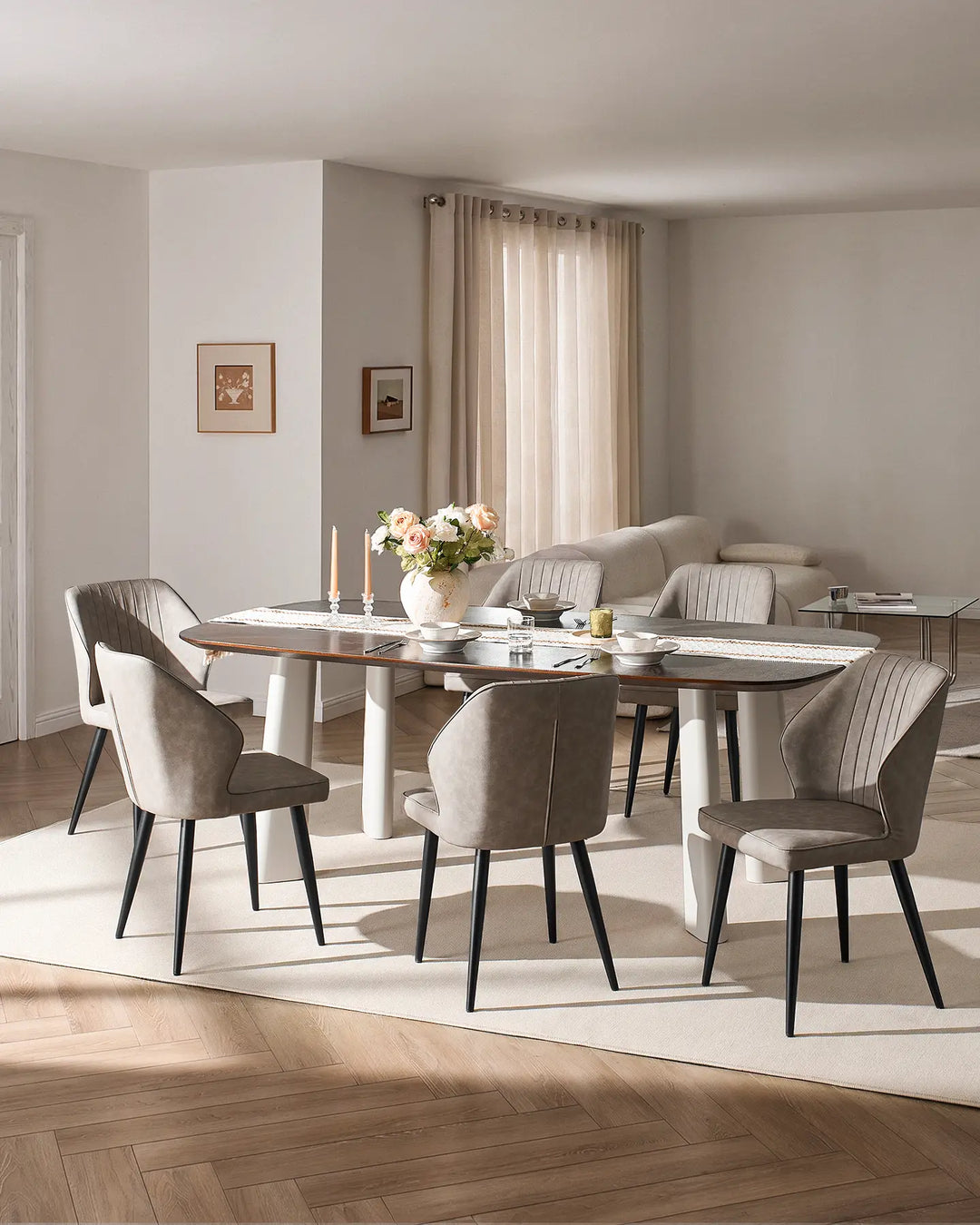 Full dining set view showing multiple Danforth light grey chairs around a large rectangular table.