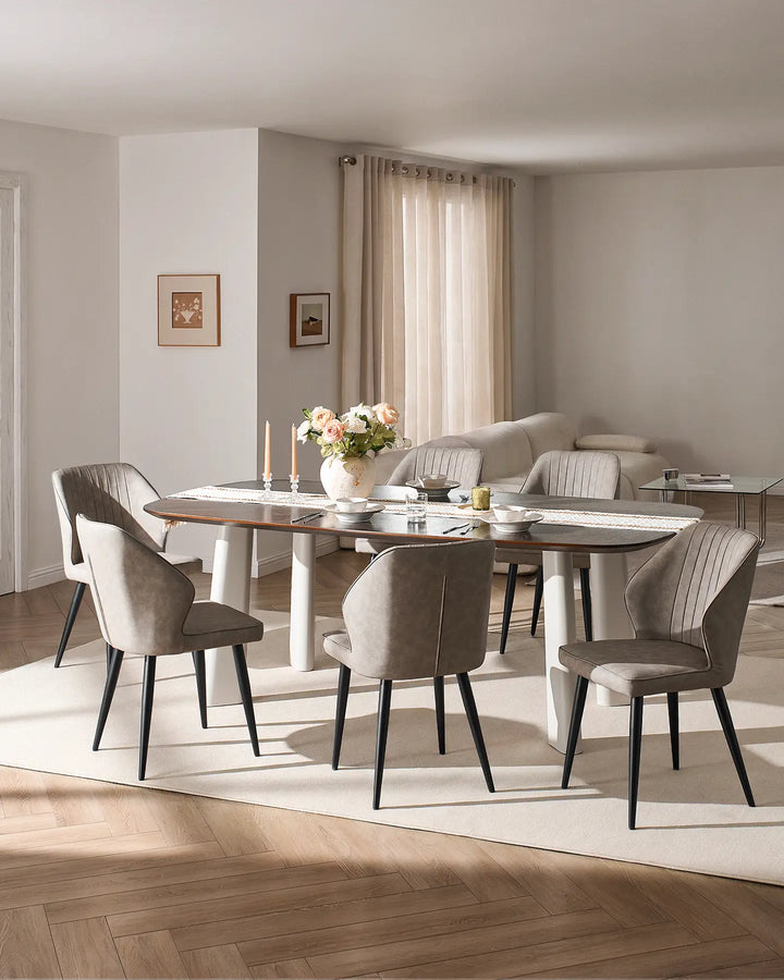 Full dining set view showing multiple Danforth light grey chairs around a large rectangular table.
