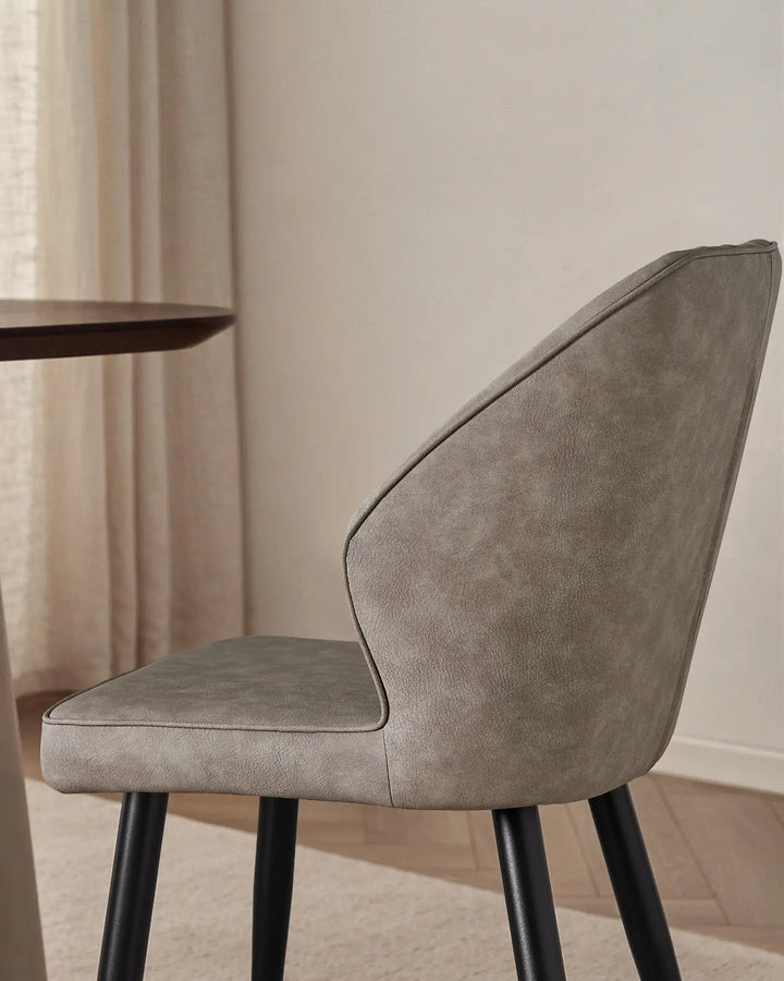 Close-up of the sleek winged side profile of the Danforth upholstered chair.