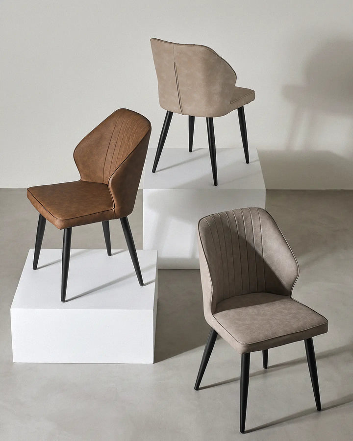 Danforth dining chairs available in Light Grey, Beige, and Brown faux leather options.