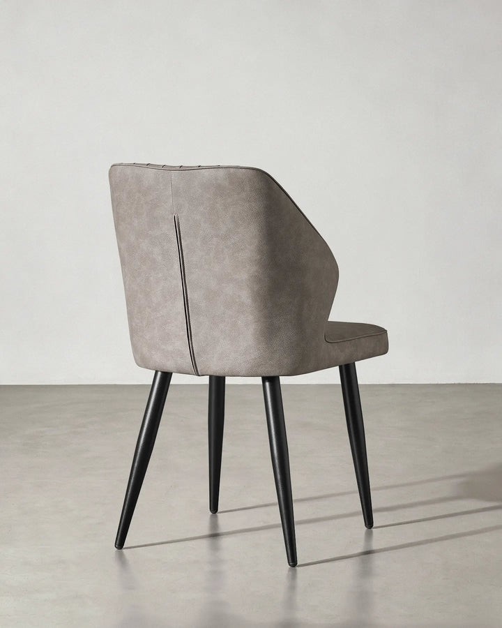 Rear view of the Danforth dining chair showcasing the clean finish of the upholstery.