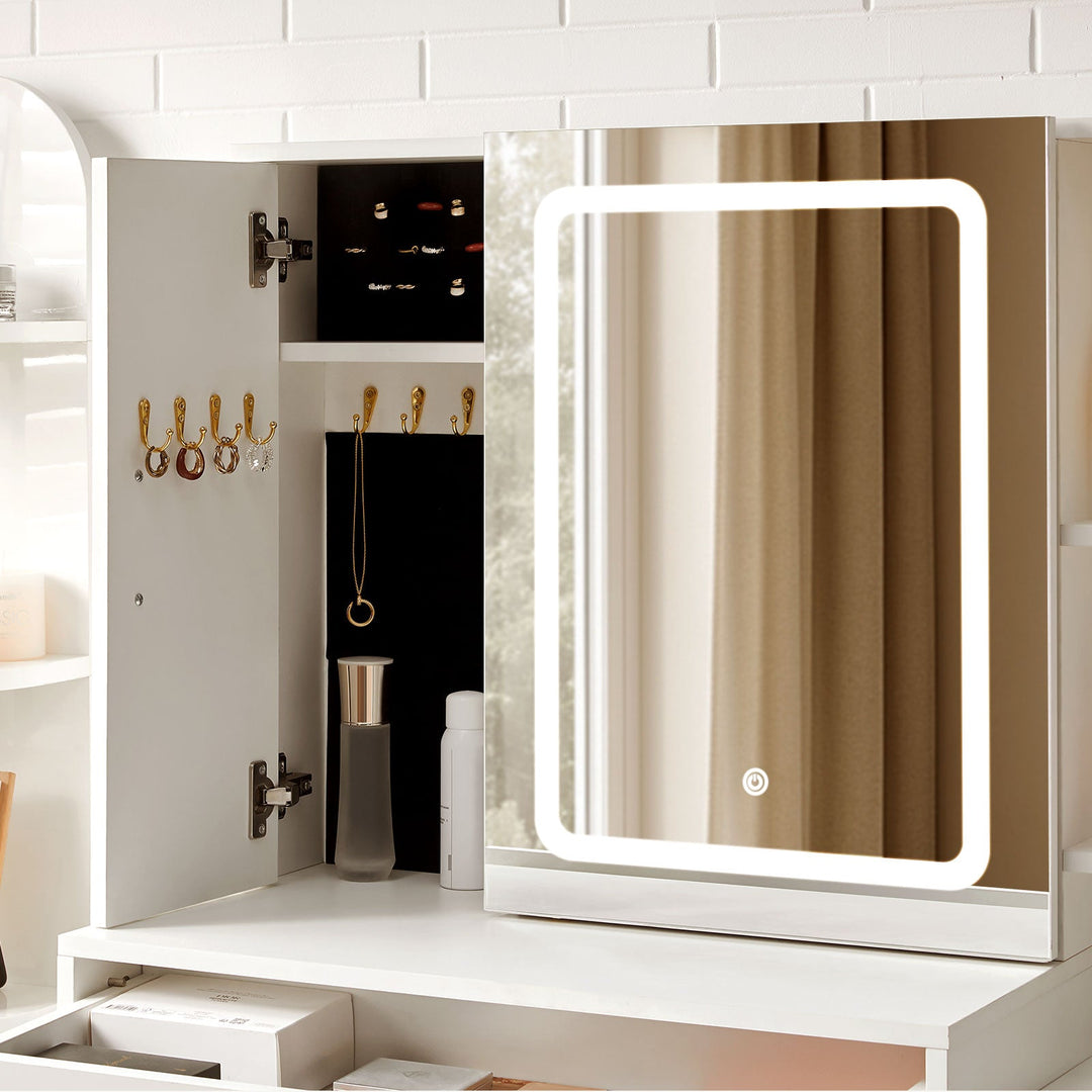 The jewellery cabinet of Daphne Dressing Table open, storing rings, earrings and necklaces.