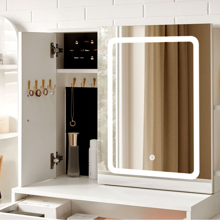 The jewellery cabinet of Daphne Dressing Table open, storing rings, earrings and necklaces.