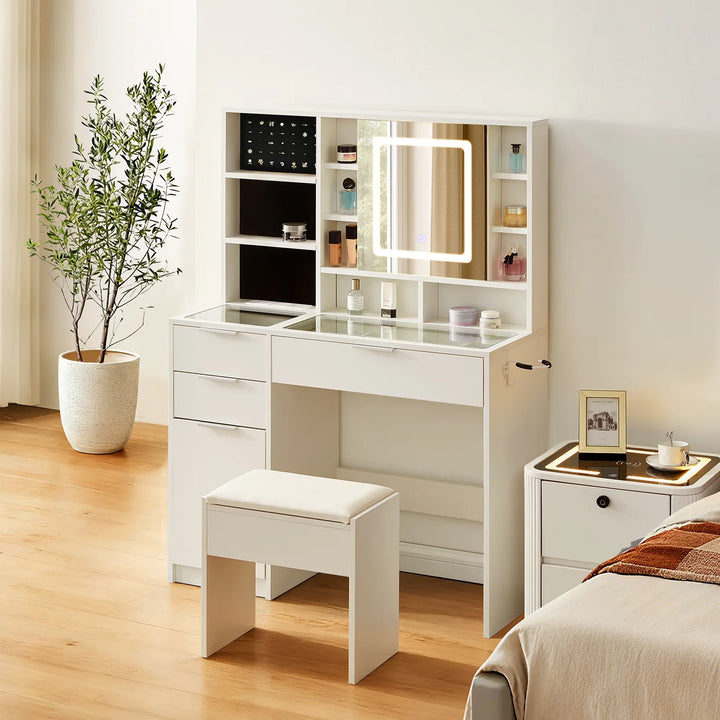 Dorla Dressing Table & Stool Set in a bright bedroom beside a bedside table