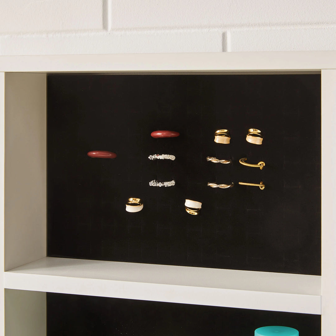 Soft perforated foam of the Dorla Dressing Table, inserting  rings, earrings, and necklaces
