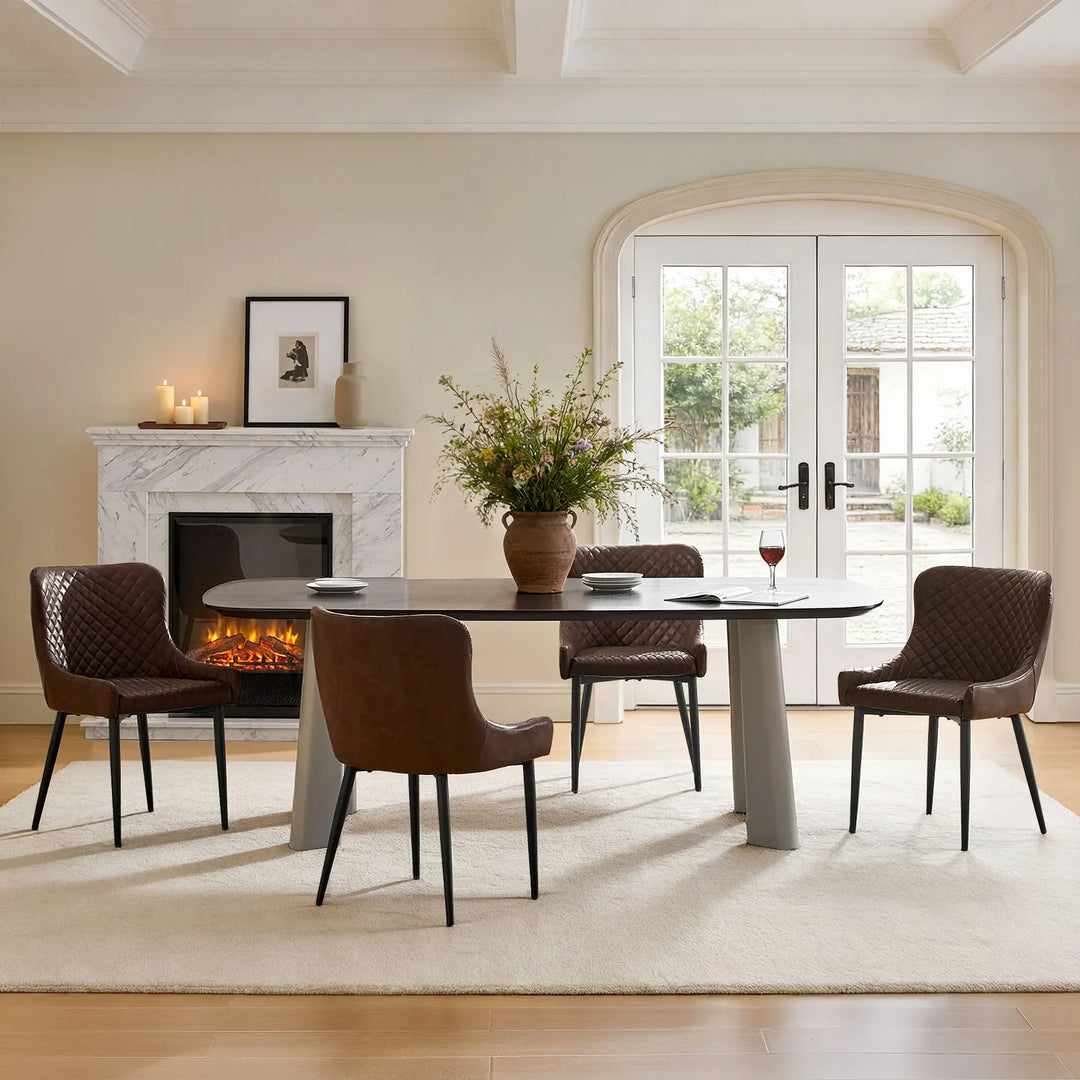 Set of four brown faux leather dining chairs beside a dining table in a contemporary dining interior