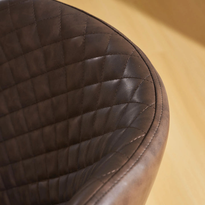 Rear stitching detail of the brown faux leather dining chair showing clean and refined craftsmanship