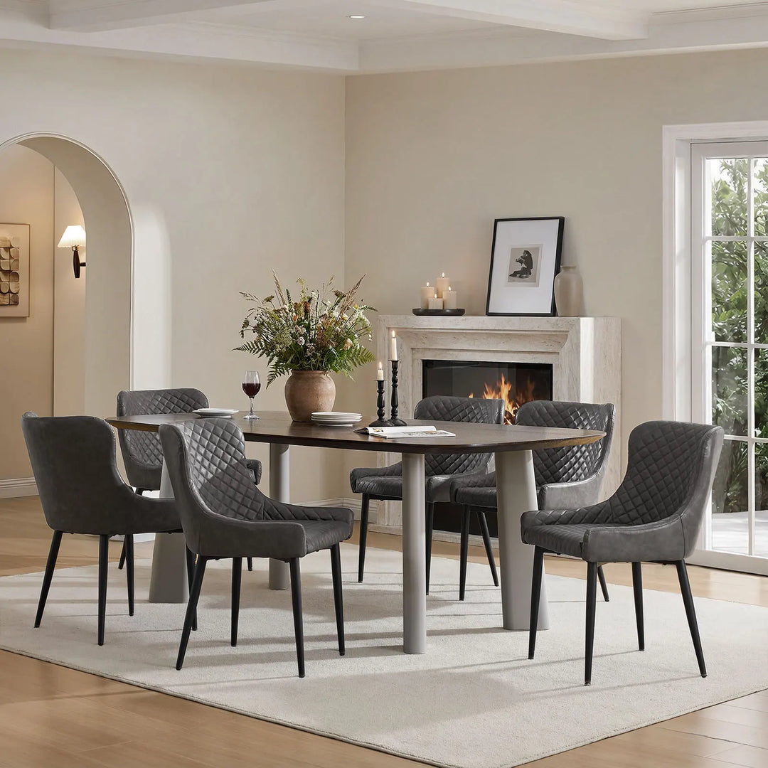 Six grey faux leather dining chairs placed around a dining table in a modern dining room