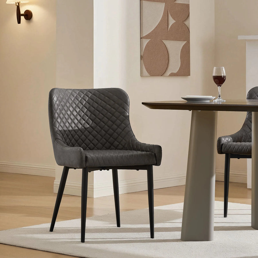 Grey faux leather dining chair in a modern family dining room