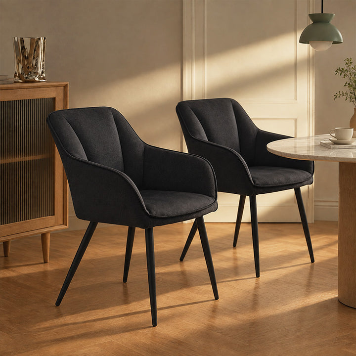 A set of 2 Earven black velvet dining chairs in the kitchen