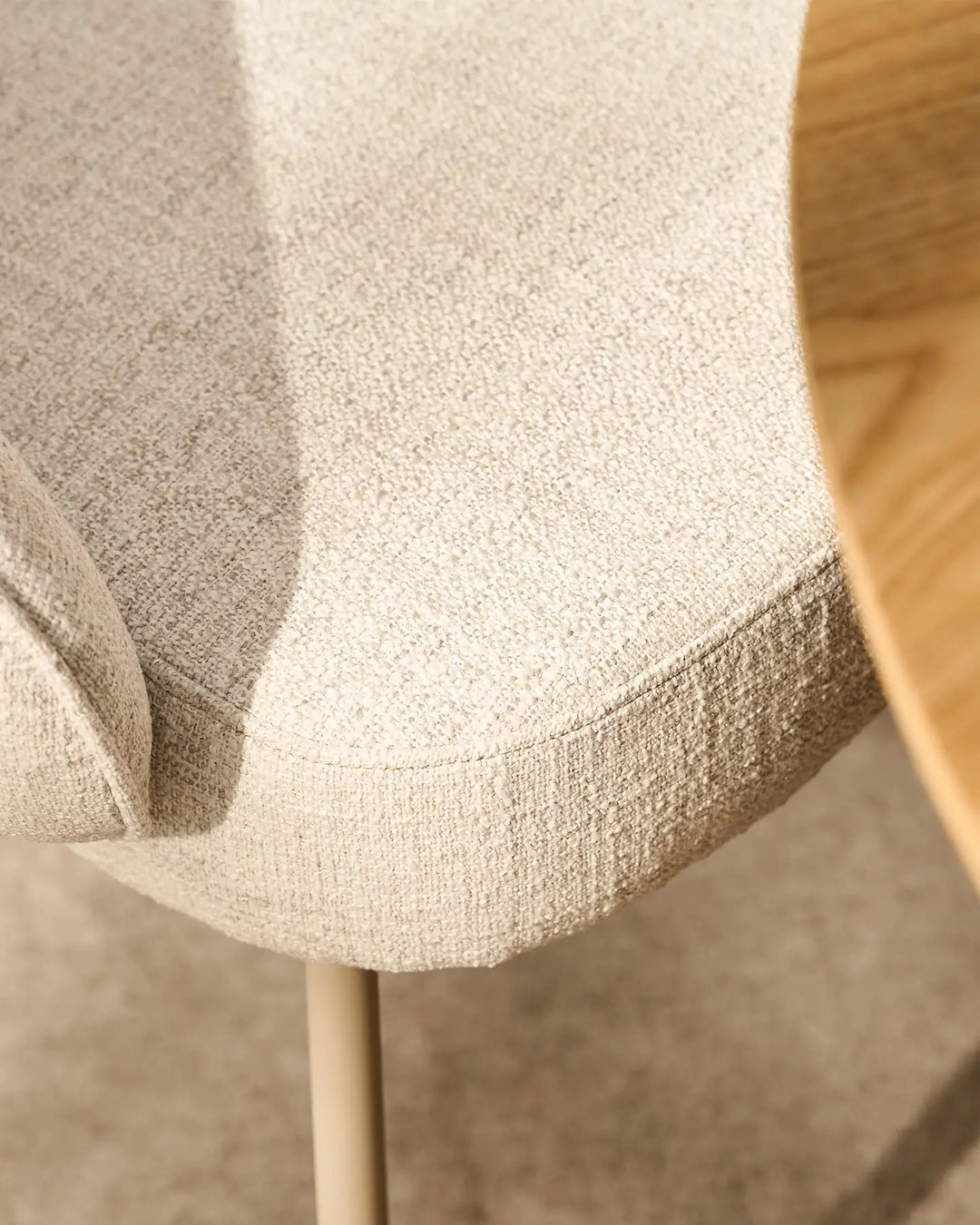 Close-up of the premium beige linen upholstery on the Elowen dining chair with a soft woven texture