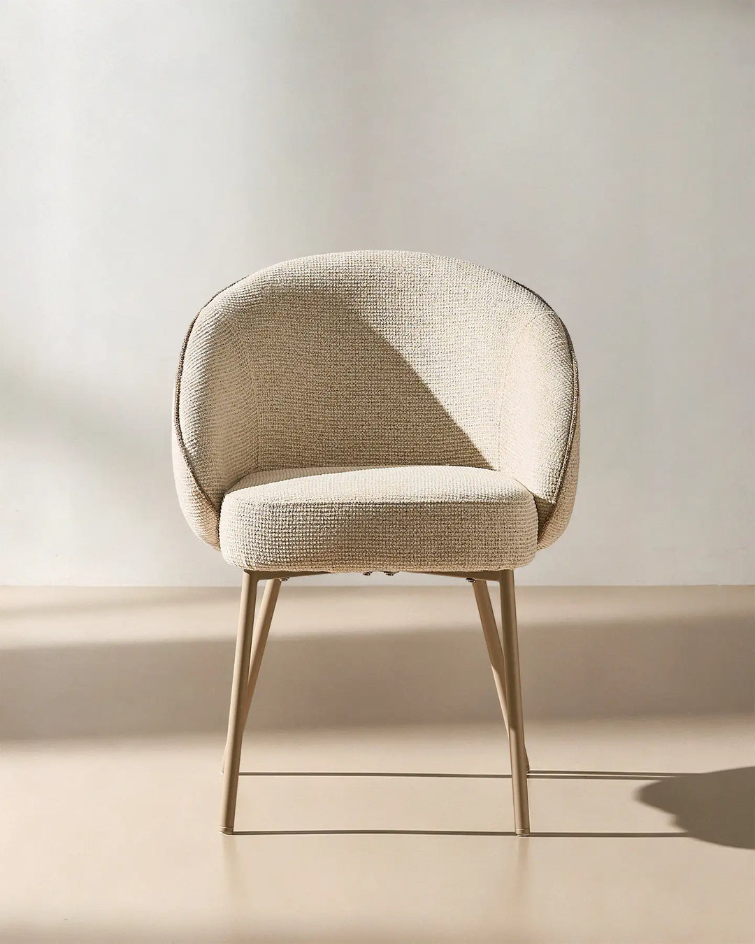 Front view of the Elowen cream and brown chenille dining chair with thick padded seat, curved backrest and upholstered armrests