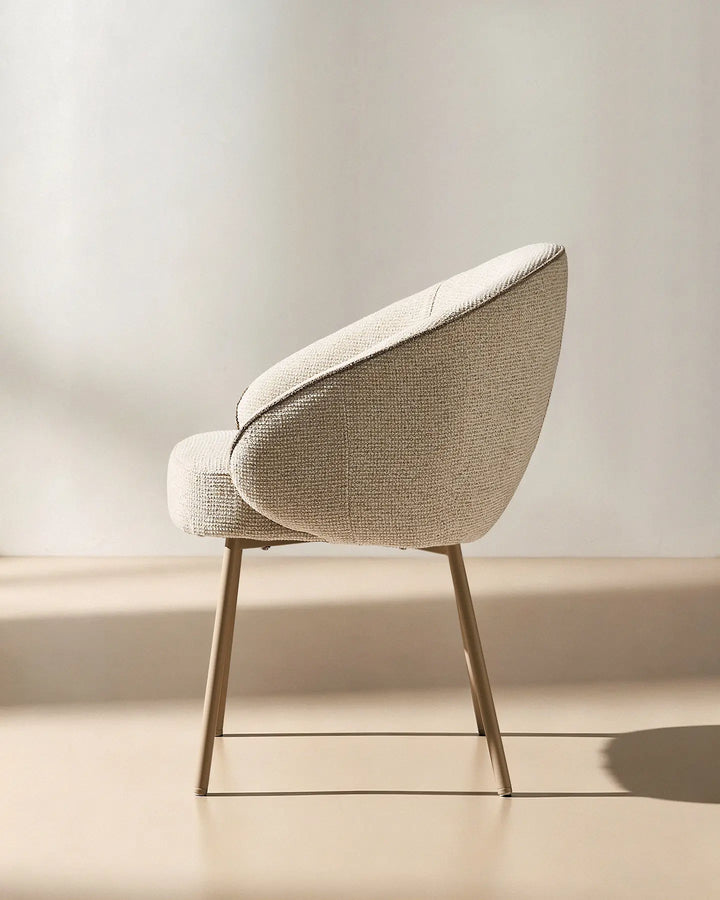 Side view of the Elowen cream and brown chenille dining chair showing the supportive curved back and generously padded seat