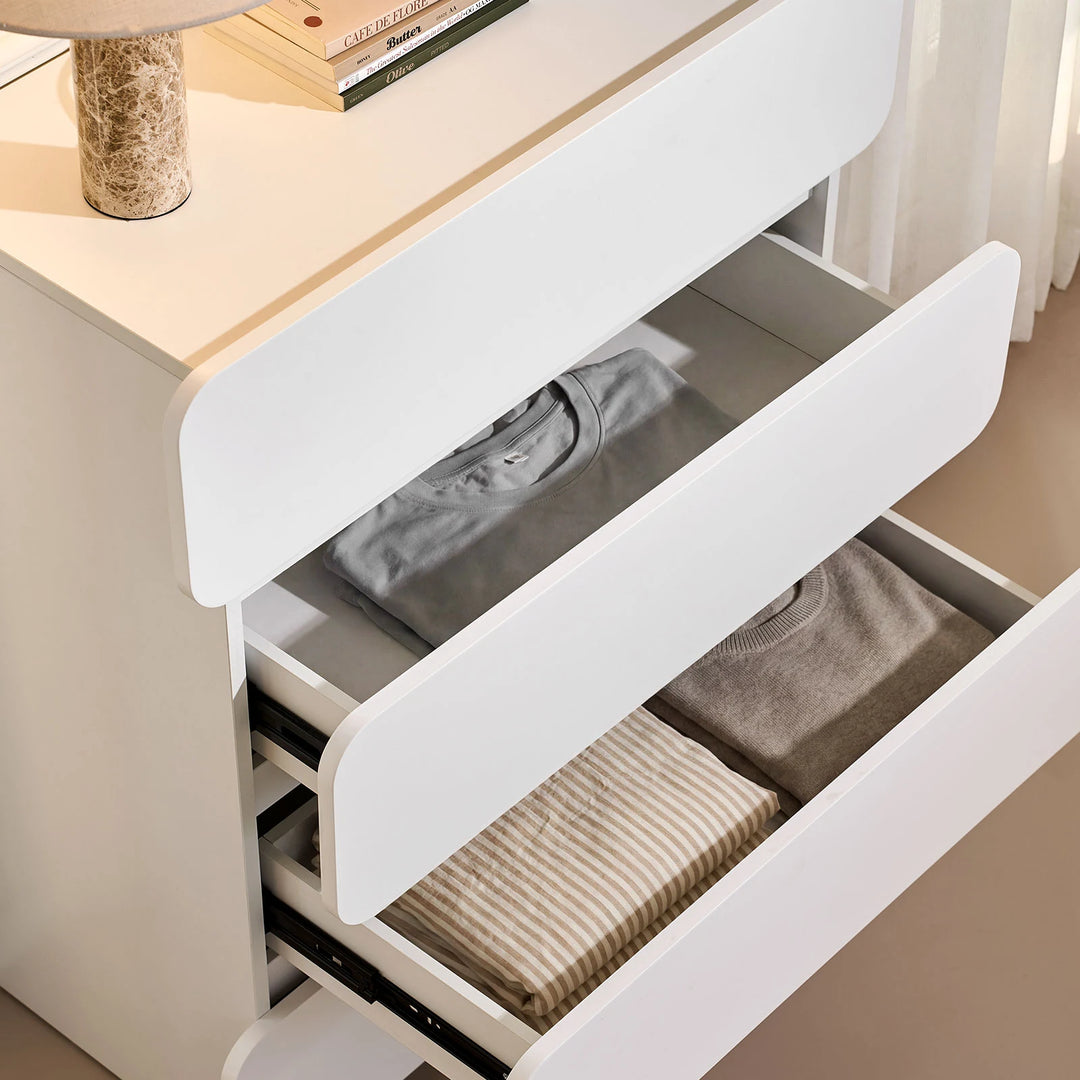 Ennis Chest of Drawers with drawers open, revealing generous storage space suitable for everyday essentials.