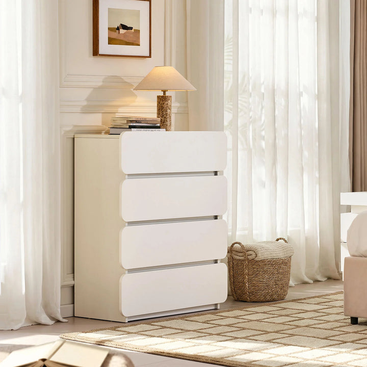 Side view of Ennis 4 Drawer Chest of Drawers positioned by the bed, showcasing its sleek and contemporary bedroom style.