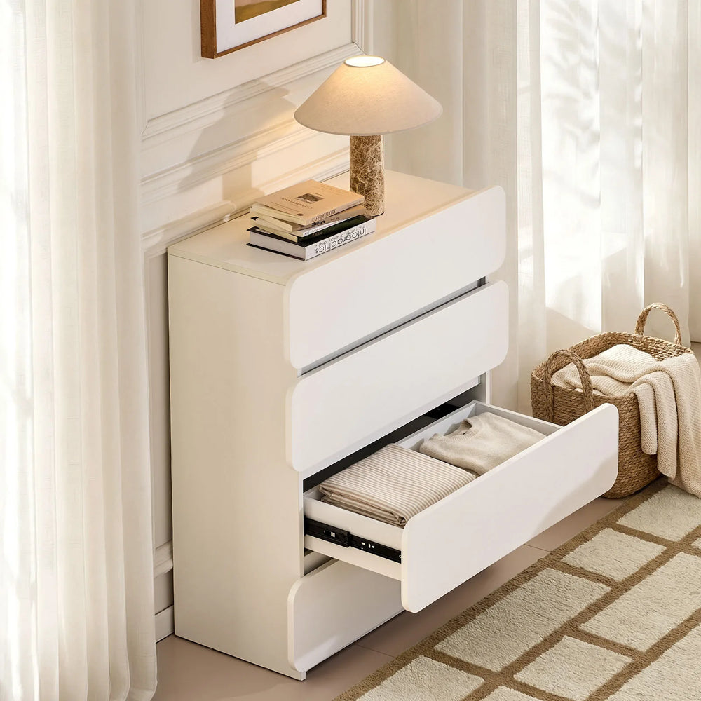 Ennis 4 Drawer Chest of Drawers with drawers open, neatly storing clothing and folded textiles.