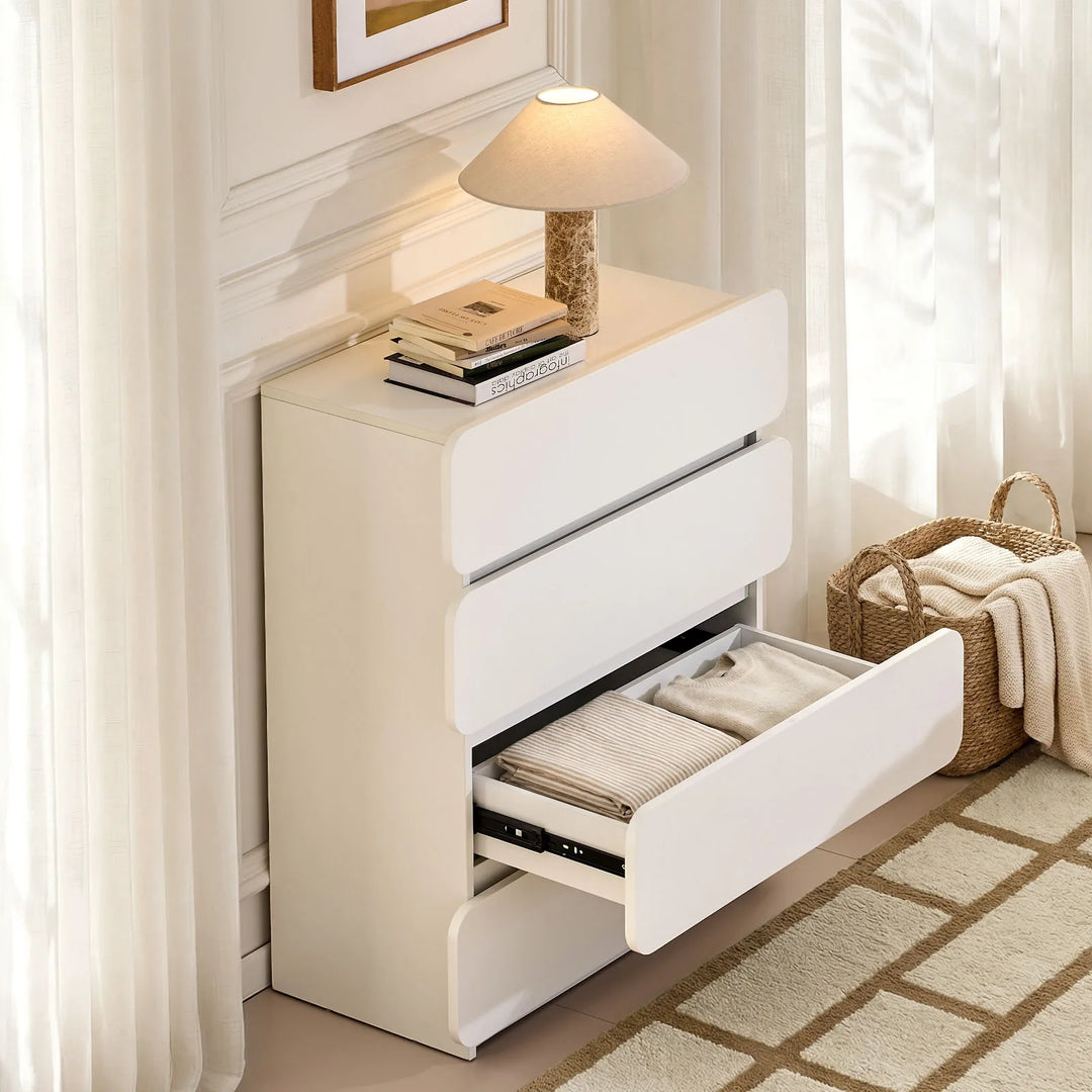 Ennis 4 Drawer Chest of Drawers with drawers open, neatly storing clothing and folded textiles.