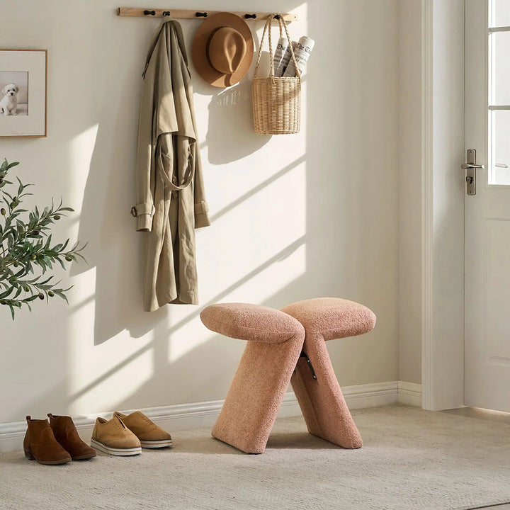 Faye Pink Accent Stool used as a hallway shoe stool near the front door, ideal for everyday use