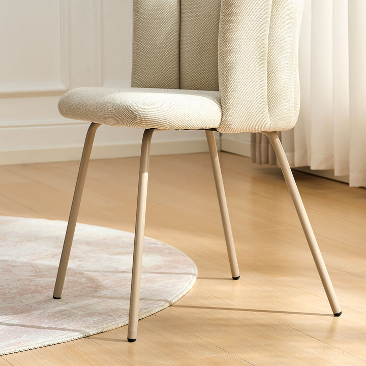 Close-up of Fleur Cream Fabric desk chair taupe metal legs with sleek finish.