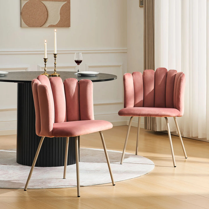 Pair of pink Fleur Fabric dining chairs adding style to a small dining space.