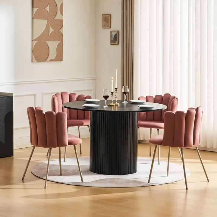 Set of four pink Fleur Fabric dining chairs creating a warm, modern dining area.