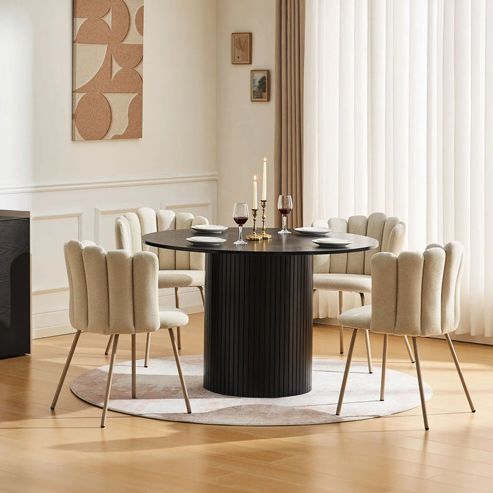 Set of four Fleur Cream Fabric dining chairs creating a warm, modern dining area.