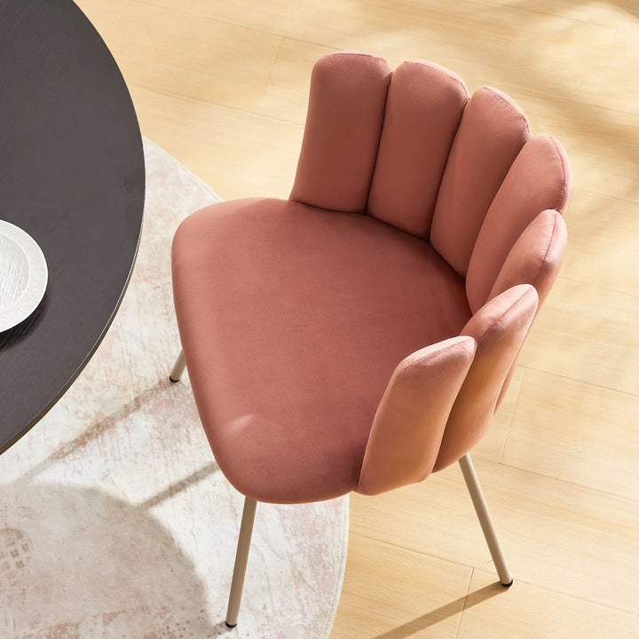 Soft padded seat of pink Fleur Fabric dining chair offering comfort and support.