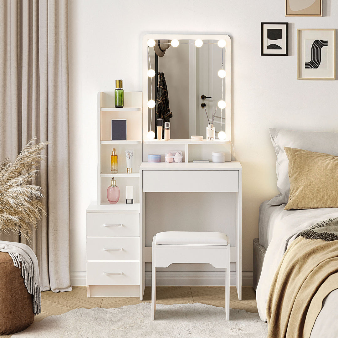 The front view of the white dressing table set, with a mirror and 10 LED bulbs, a 3-drawer cabinet, a big drawer under the tabletop, several shelves, and a stool, in a bright bedroom.