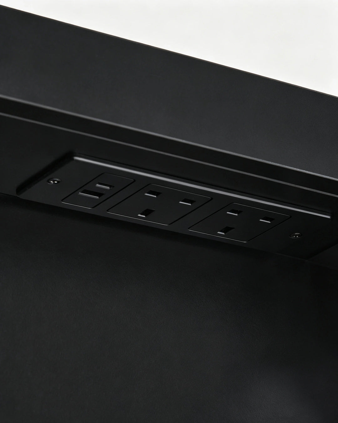Internal black socket and USB charging hub inside the Arcadia cabinet.