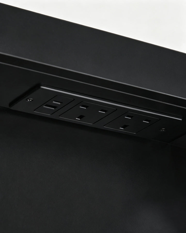 Internal black socket and USB charging hub inside the Arcadia cabinet.