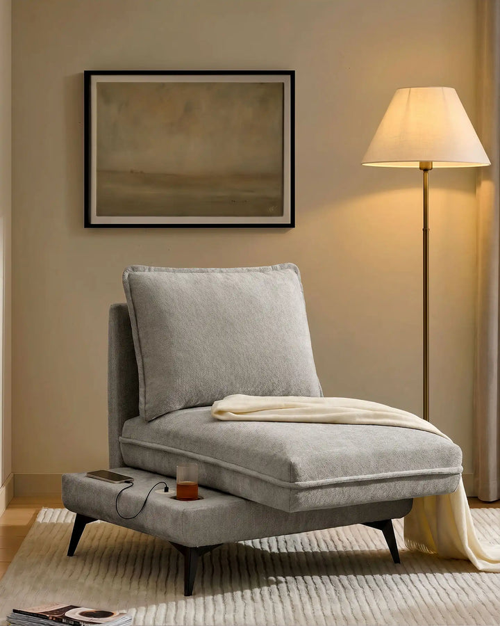 Hudson grey modular sofa (left) in living room corner with extended seat showing USB port and built-in cup holder